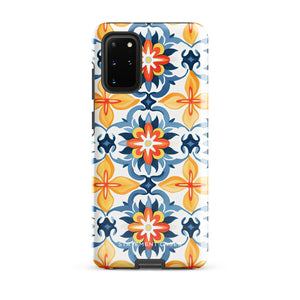 The Mediterranean Bloom for Samsung by Statement Cases features intricate, colorful floral patterns in blue, orange, and yellow. The design covers the entire back of the case, surrounding the camera cutout. Shock-absorbing and impact-resistant, it ensures protection while the brand "Statement Cases" is subtly printed near the bottom.