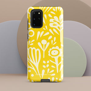 The Sol Dorado for Samsung by Statement Cases is a durable phone case featuring a bright yellow background adorned with an abstract white floral pattern, showcasing various flowers and leaves. Near the bottom edge, the text "STATEMENT CASE" highlights its dual-layer design for enhanced durability.