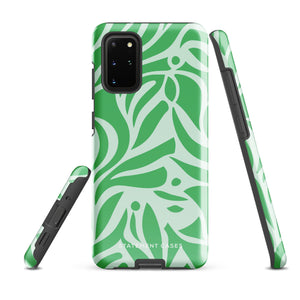 The Selva Verde for Samsung, a product by Statement Cases, is a durable, dual-layer phone case adorned with a green and white leafy design. The back of the case includes a camera cutout, and the bottom is printed with "Statement Cases.