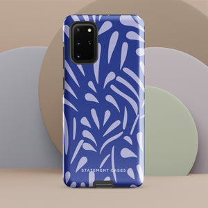 The Mariposa Azul for Samsung smartphone case from Statement Cases is adorned with an impact-resistant design featuring light purple abstract shapes on a blue background. This dual-layer case proudly displays the text "STATEMENT CASES" at the bottom, ensuring that the camera lenses and buttons of your phone remain clearly visible.