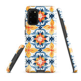 The Mediterranean Bloom for Samsung by Statement Cases features intricate, colorful floral patterns in blue, orange, and yellow. The design covers the entire back of the case, surrounding the camera cutout. Shock-absorbing and impact-resistant, it ensures protection while the brand "Statement Cases" is subtly printed near the bottom.