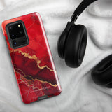 A red and black Scarlet Marble for Samsung with a marble-like pattern and gold accents, designed for a phone with multiple rear cameras. This tough phone case features an impact-resistant, dual-layer design and showcases the brand name "Statement Cases" near the bottom.