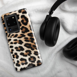 A tough phone case with a leopard print design is displayed. The dual-layer design features black and brown spots on a tan background, mimicking leopard fur. The text "Statement Cases" is printed on the lower part of the impact-resistant case. This is the Mighty Jaguar Fur for Samsung by Statement Cases.