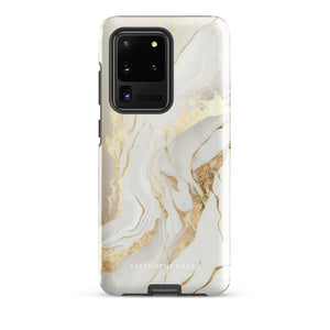 A Golden Elegance for Samsung is encased in a decorative, impact-resistant phone case with a marble-like design featuring white, beige, and gold swirls. The tough phone case covers the back and sides, with precise cutouts for the four-lens camera and buttons. The brand "Statement Cases" is printed at the bottom.