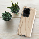 A Sandy Serenity for Samsung encased in a beige, impact-resistant phone case with wavy, textured patterns. Four camera lenses are visible on the back. The lower part of the dual-layer design case displays the text "Statement Cases.