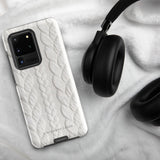 A stylish, impact-resistant phone case with a textured white braided design, covering the back of a smartphone. The dual-layer design features cutouts for the camera and buttons, and "Cozy Knit Bliss for Samsung" by Statement Cases is embossed at the bottom.