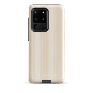 A beige smartphone case with vertical stripes designed for a phone with a triple camera setup. This impact-resistant phone case features precise cutouts for the cameras, buttons, and other essential functions. "Statement Cases" is printed at the bottom of the tough phone case. Product Name: Noble Pinstripe for Samsung