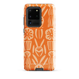 This stylish smartphone accessory, the Savannah Ardiente for Samsung by Statement Cases, features a shock-absorbing, colorful patterned case adorned with abstract flower designs in beige on an orange background. This impact-resistant phone case wraps around the back of your device, providing robust protection for its multiple camera lenses in the corner.