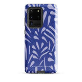 The Mariposa Azul for Samsung smartphone case from Statement Cases is adorned with an impact-resistant design featuring light purple abstract shapes on a blue background. This dual-layer case proudly displays the text "STATEMENT CASES" at the bottom, ensuring that the camera lenses and buttons of your phone remain clearly visible.