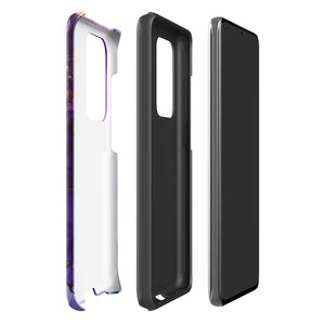 The Golden Orchid Marble for Samsung by Statement Cases is a smartphone adorned with a vibrant, abstract phone case showcasing a mix of purple, pink, and gold colors. Crafted from impact-resistant materials, it features a camera module with four lenses and a flash. At the bottom of the shock-absorbing phone case, you’ll find the text "STATEMENT CASES" in white.