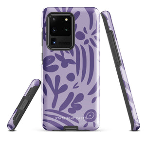 Introducing the Luna Morada for Samsung, a striking smartphone case from Statement Cases. This decorative purple cover boasts abstract floral and organic patterns in darker hues and is designed to absorb shocks. The impact-resistant case features a camera cutout that accommodates five lenses, with the brand name "STATEMENT CASES" elegantly printed at the bottom center.