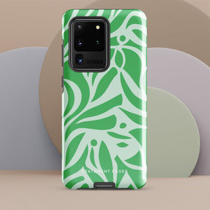 The Selva Verde for Samsung, a product by Statement Cases, is a durable, dual-layer phone case adorned with a green and white leafy design. The back of the case includes a camera cutout, and the bottom is printed with "Statement Cases.