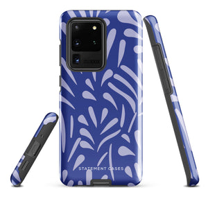 The Mariposa Azul for Samsung smartphone case from Statement Cases is adorned with an impact-resistant design featuring light purple abstract shapes on a blue background. This dual-layer case proudly displays the text "STATEMENT CASES" at the bottom, ensuring that the camera lenses and buttons of your phone remain clearly visible.