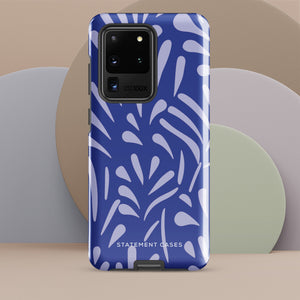 The Mariposa Azul for Samsung smartphone case from Statement Cases is adorned with an impact-resistant design featuring light purple abstract shapes on a blue background. This dual-layer case proudly displays the text "STATEMENT CASES" at the bottom, ensuring that the camera lenses and buttons of your phone remain clearly visible.