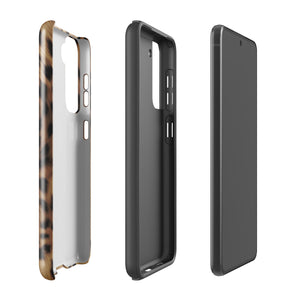 A smartphone with a leopard print, dual-layer design phone case featuring four camera lenses on the back is displayed against a white background. The bottom of the tough phone case has the brand name "Statement Cases" in white letters. The product name is "Daring Cheetah Fur for Samsung".