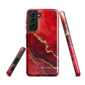 A red and black Scarlet Marble for Samsung with a marble-like pattern and gold accents, designed for a phone with multiple rear cameras. This tough phone case features an impact-resistant, dual-layer design and showcases the brand name "Statement Cases" near the bottom.