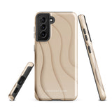 A Sandy Serenity for Samsung encased in a beige, impact-resistant phone case with wavy, textured patterns. Four camera lenses are visible on the back. The lower part of the dual-layer design case displays the text "Statement Cases.