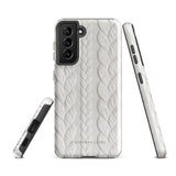 A stylish, impact-resistant phone case with a textured white braided design, covering the back of a smartphone. The dual-layer design features cutouts for the camera and buttons, and "Cozy Knit Bliss for Samsung" by Statement Cases is embossed at the bottom.