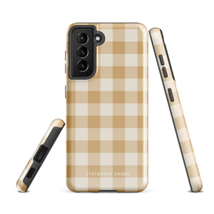 A beige and white checkered phone case is shown. Designed to fit a smartphone with a horizontal dual-camera setup, it features "STATEMENT CASES" printed at the bottom. This impact-resistant phone case offers both style and protection.Product Name: Gingham Grace for Samsung Brand Name: Statement Cases