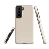 A beige smartphone case with vertical stripes designed for a phone with a triple camera setup. This impact-resistant phone case features precise cutouts for the cameras, buttons, and other essential functions. "Statement Cases" is printed at the bottom of the tough phone case. Product Name: Noble Pinstripe for Samsung