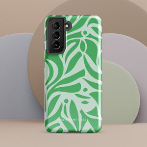 The Selva Verde for Samsung, a product by Statement Cases, is a durable, dual-layer phone case adorned with a green and white leafy design. The back of the case includes a camera cutout, and the bottom is printed with "Statement Cases.