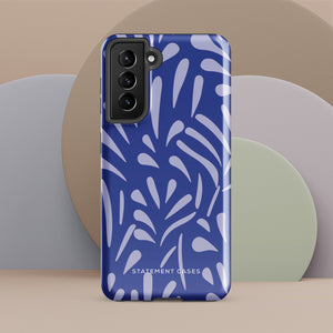 The Mariposa Azul for Samsung smartphone case from Statement Cases is adorned with an impact-resistant design featuring light purple abstract shapes on a blue background. This dual-layer case proudly displays the text "STATEMENT CASES" at the bottom, ensuring that the camera lenses and buttons of your phone remain clearly visible.