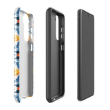 The Mediterranean Bloom for Samsung by Statement Cases features intricate, colorful floral patterns in blue, orange, and yellow. The design covers the entire back of the case, surrounding the camera cutout. Shock-absorbing and impact-resistant, it ensures protection while the brand "Statement Cases" is subtly printed near the bottom.