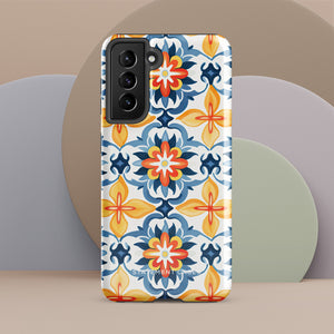 The Mediterranean Bloom for Samsung by Statement Cases features intricate, colorful floral patterns in blue, orange, and yellow. The design covers the entire back of the case, surrounding the camera cutout. Shock-absorbing and impact-resistant, it ensures protection while the brand "Statement Cases" is subtly printed near the bottom.