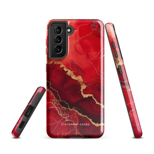 A red and black Scarlet Marble for Samsung with a marble-like pattern and gold accents, designed for a phone with multiple rear cameras. This tough phone case features an impact-resistant, dual-layer design and showcases the brand name "Statement Cases" near the bottom.