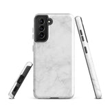 A dual-layer design smartphone case with a white marble pattern features three large camera lenses and a smaller one on the back. "Statement Cases" is subtly printed near the bottom. The minimalistic, matte finish offers impact-resistant protection with style.