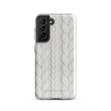 A stylish, impact-resistant phone case with a textured white braided design, covering the back of a smartphone. The dual-layer design features cutouts for the camera and buttons, and "Cozy Knit Bliss for Samsung" by Statement Cases is embossed at the bottom.