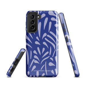 The Mariposa Azul for Samsung smartphone case from Statement Cases is adorned with an impact-resistant design featuring light purple abstract shapes on a blue background. This dual-layer case proudly displays the text "STATEMENT CASES" at the bottom, ensuring that the camera lenses and buttons of your phone remain clearly visible.