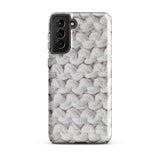 A Chunky Comfort for Samsung with a realistic knitted texture featuring white interwoven yarns. The impact-resistant case has multiple camera cutouts and a shock-absorbing dual-layer design. The brand name "Statement Cases" is printed at the bottom.