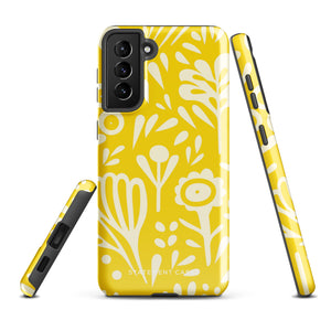 The Sol Dorado for Samsung by Statement Cases is a durable phone case featuring a bright yellow background adorned with an abstract white floral pattern, showcasing various flowers and leaves. Near the bottom edge, the text "STATEMENT CASE" highlights its dual-layer design for enhanced durability.