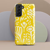 The Sol Dorado for Samsung by Statement Cases is a durable phone case featuring a bright yellow background adorned with an abstract white floral pattern, showcasing various flowers and leaves. Near the bottom edge, the text "STATEMENT CASE" highlights its dual-layer design for enhanced durability.