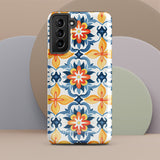 The Mediterranean Bloom for Samsung by Statement Cases features intricate, colorful floral patterns in blue, orange, and yellow. The design covers the entire back of the case, surrounding the camera cutout. Shock-absorbing and impact-resistant, it ensures protection while the brand "Statement Cases" is subtly printed near the bottom.