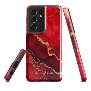 A red and black Scarlet Marble for Samsung with a marble-like pattern and gold accents, designed for a phone with multiple rear cameras. This tough phone case features an impact-resistant, dual-layer design and showcases the brand name "Statement Cases" near the bottom.