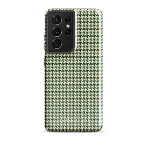 A smartphone with a green and white houndstooth patterned impact-resistant case is shown. The phone's camera module with multiple lenses is visible on the top left corner of the Elegance Houndstooth for Samsung shock-absorbing case by Statement Cases.