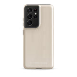 A beige smartphone case with vertical stripes designed for a phone with a triple camera setup. This impact-resistant phone case features precise cutouts for the cameras, buttons, and other essential functions. "Statement Cases" is printed at the bottom of the tough phone case. Product Name: Noble Pinstripe for Samsung