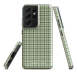 A smartphone with a green and white houndstooth patterned impact-resistant case is shown. The phone's camera module with multiple lenses is visible on the top left corner of the Elegance Houndstooth for Samsung shock-absorbing case by Statement Cases.