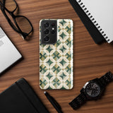 The Grand Estate Mosaic for Samsung features a geometric design with interlocking circles and X-shaped patterns in green, beige, and white tones. The impact-resistant, dual-layer design creates a modern, symmetrical appearance. "Statement Cases" is printed at the bottom of the case.