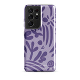 Introducing the Luna Morada for Samsung, a striking smartphone case from Statement Cases. This decorative purple cover boasts abstract floral and organic patterns in darker hues and is designed to absorb shocks. The impact-resistant case features a camera cutout that accommodates five lenses, with the brand name "STATEMENT CASES" elegantly printed at the bottom center.