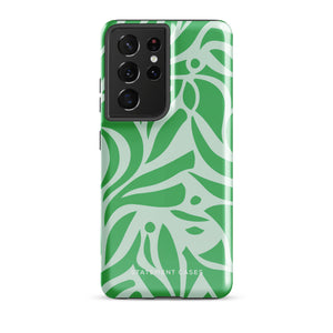 The Selva Verde for Samsung, a product by Statement Cases, is a durable, dual-layer phone case adorned with a green and white leafy design. The back of the case includes a camera cutout, and the bottom is printed with "Statement Cases.