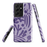 Introducing the Luna Morada for Samsung, a striking smartphone case from Statement Cases. This decorative purple cover boasts abstract floral and organic patterns in darker hues and is designed to absorb shocks. The impact-resistant case features a camera cutout that accommodates five lenses, with the brand name "STATEMENT CASES" elegantly printed at the bottom center.