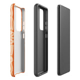 This stylish smartphone accessory, the Savannah Ardiente for Samsung by Statement Cases, features a shock-absorbing, colorful patterned case adorned with abstract flower designs in beige on an orange background. This impact-resistant phone case wraps around the back of your device, providing robust protection for its multiple camera lenses in the corner.