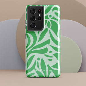 The Selva Verde for Samsung, a product by Statement Cases, is a durable, dual-layer phone case adorned with a green and white leafy design. The back of the case includes a camera cutout, and the bottom is printed with "Statement Cases.