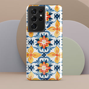 The Mediterranean Bloom for Samsung by Statement Cases features intricate, colorful floral patterns in blue, orange, and yellow. The design covers the entire back of the case, surrounding the camera cutout. Shock-absorbing and impact-resistant, it ensures protection while the brand "Statement Cases" is subtly printed near the bottom.