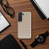 A Samsung smartphone with a beige and brown houndstooth patterned, impact-resistant case from Statement Cases. The phone features multiple cameras on the upper left side of its back. This tough Classic Houndstooth for Samsung phone case has a sleek, dual-layer design with precise cutouts for the cameras and buttons.