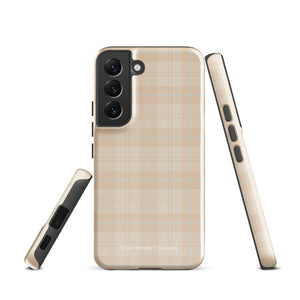 A smartphone with an impact-resistant beige plaid phone case featuring subtle light blue accents. The camera, flash, and sensor modules are visible at the top. The bottom part of the case has the text "Sophisticated Plaid for Samsung" printed on it by Statement Cases.