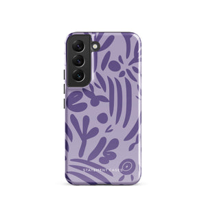 Introducing the Luna Morada for Samsung, a striking smartphone case from Statement Cases. This decorative purple cover boasts abstract floral and organic patterns in darker hues and is designed to absorb shocks. The impact-resistant case features a camera cutout that accommodates five lenses, with the brand name "STATEMENT CASES" elegantly printed at the bottom center.